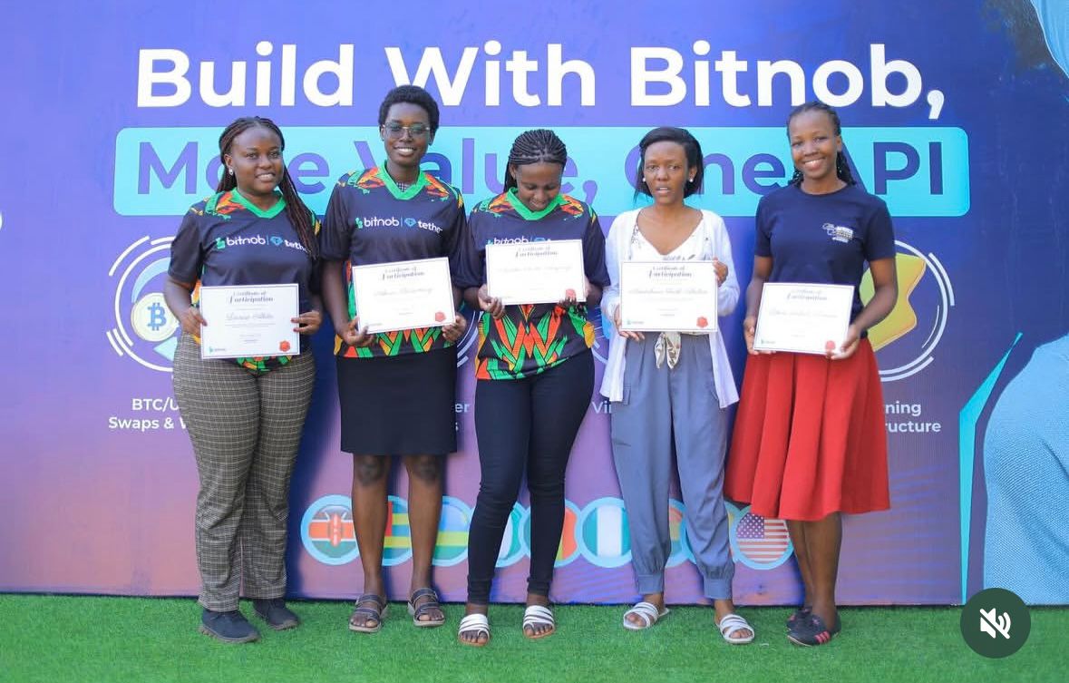 Bitnob team members with certificates